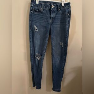 Distressed bluejeans jeans